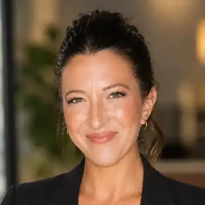Chiropractic Leland NC Lydia Smith Professional headshot with dark hair pulled back